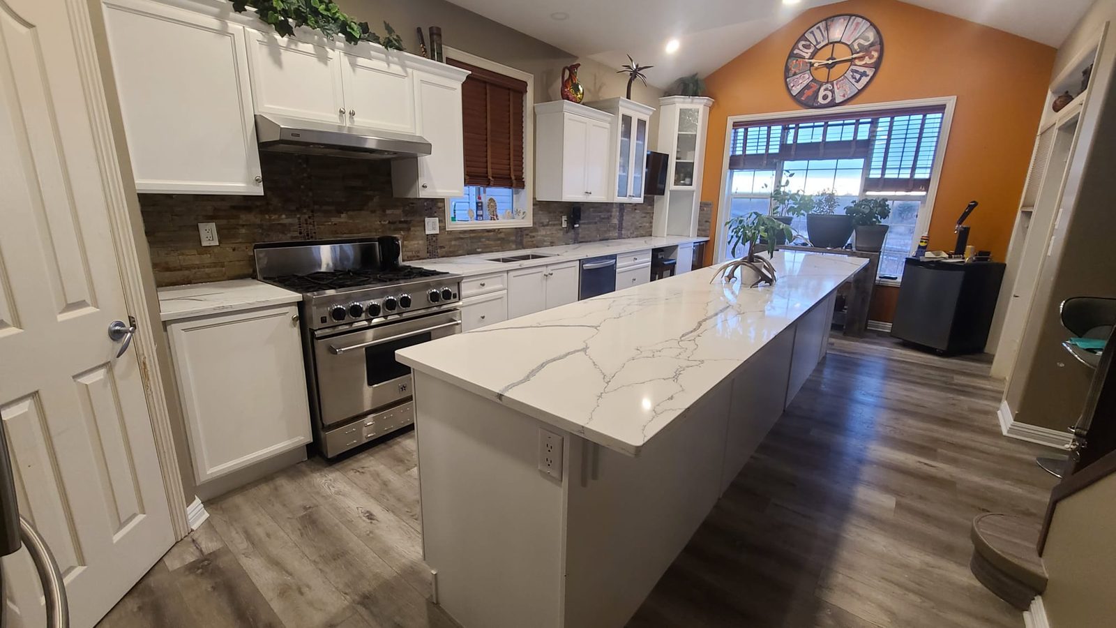 Marble-look quartz island with waterfall sides