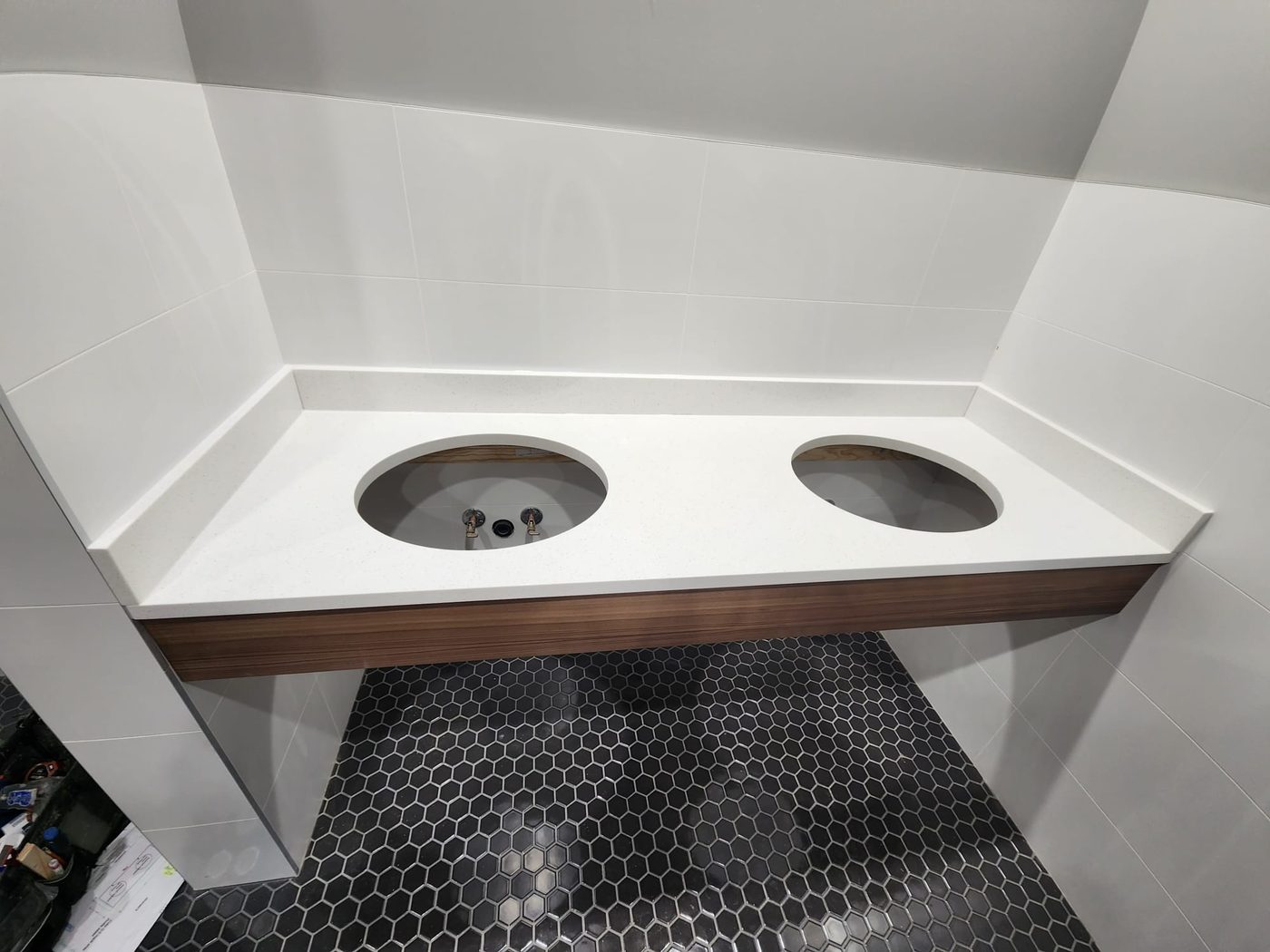 Double vanity top with basin cut-outs, templated before installation